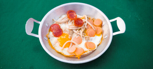 pan-fried egg with pork and toppings. Breakfast food in Thai style