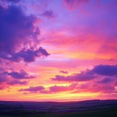 Obraz premium Beautiful Sunset Over Rolling Hills with Vibrant Clouds and Colors