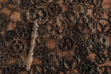 Closeup of old rusty gears and key filled with paraffin.