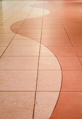 Wavy Pattern of Light and Dark Beige Tiles on Floor