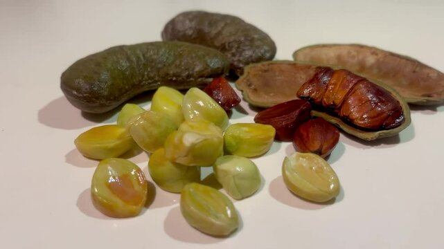 Genuak or Kerdas is a Malay ulam made from winged bean pods (Psophocarpus tetragonolobus), eaten raw or blanched with sambal or rice. It has a refreshing, slightly bitter taste and crunchy texture.