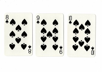 A hand of playing cards showing a run of three on a white background.