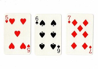 A hand of playing cards showing a run of three on a white background.