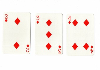 A hand of playing cards showing a run of three in the same suit.