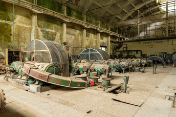 Compressor hall in an abandoned power plant for energy generation - Old-fashioned machinery for compression