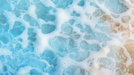 Calm and refreshing water texture featuring shades of blue and patches of foam. This background provides ample copy space for design elements while evoking a serene aquatic feeling