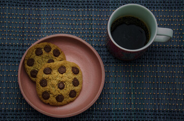 cup of coffee with cookies