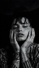 Dark and Dramatic Portrait of a Tattooed Person with Closed Eyes