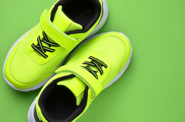Sneakers for sports on a green background. Shoes for teenagers.