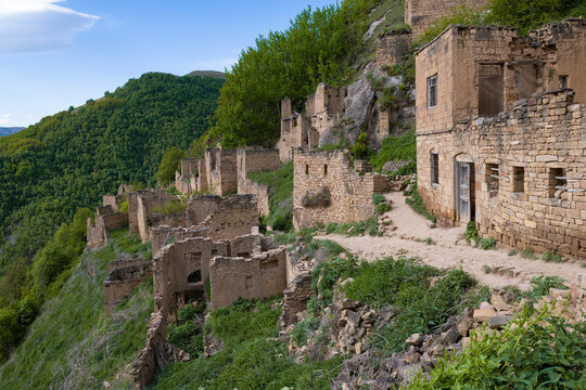 Ruins of the abandoned ancient mountain village of Gamsutl on a May morning. Republic of Dagestan, Russia