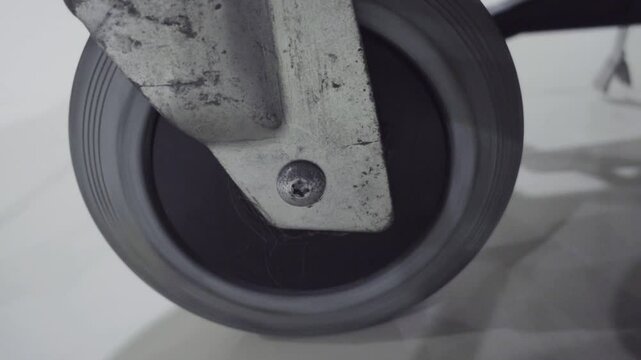 Close-up of luggage trolley wheels at the airport