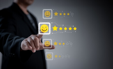 Concept of satisfaction and customer service. : Business man use use laptop touching or pressing the virtual screen Five score and five star to show satisfaction with the service or give rate.	
