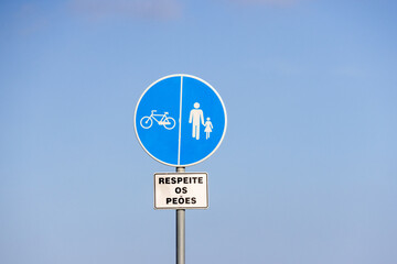 Respect pedestrians sign in portuguese language promoting road safety for cyclists and walkers