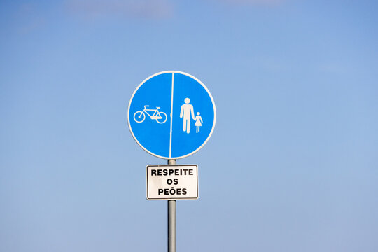 Respect pedestrians sign in portuguese language promoting road safety for cyclists and walkers