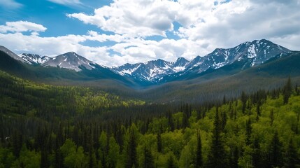 Obraz premium Panoramic View of Majestic Mountains Surrounded by Lush Forests Under a Cloudy Sky : Generative AI