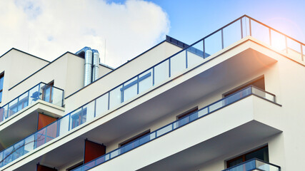 Fototapeta premium Modern and new apartment building. Multistoried modern, new and stylish living block of flats.