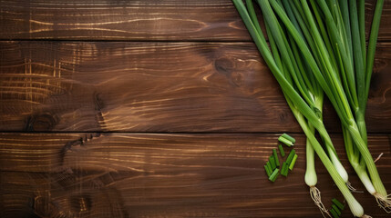 green onions on wooden background