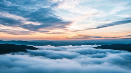 Obraz premium Stunning aerial view of mountains and valleys covered in low clouds during a vibrant sunset : Generative AI