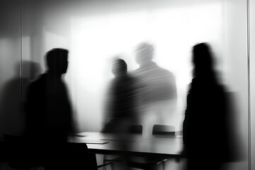 Blurred Silhouettes of People in a Modern Office Meeting