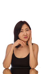 Fototapeta premium Portrait of beautiful Korean woman in her 60s demonstrating her flawless, healthy, well-kept skin isolated on white background. Concept of skin care, anti-aging treatment, cosmetology