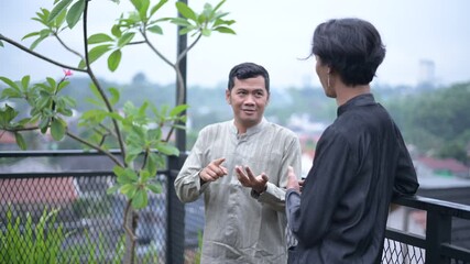 Meaningful conversation, Two colleagues sharing insights in an outdoor terrace