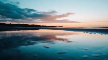 Serene beach landscape at sunset with colorful sky reflected in calm water creating a peaceful atmosphere : Generative AI
