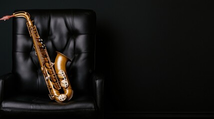 Obraz premium Elegant gold saxophone resting on a black leather armchair against a dark background in a stylish musical setting