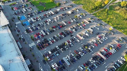 Drone shot of parking lot beside shopping center © AlexGo