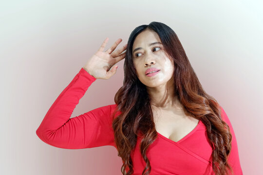 Beautiful Asian woman wearing sportswear confuse , uncertain with doubt, thinking with hand on head.