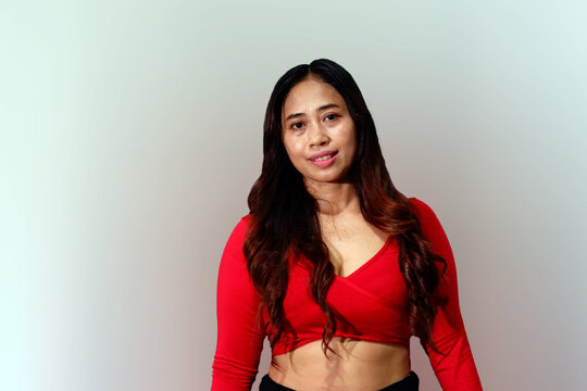 Happy Asian Woman Over white Background. Smiling girl after Fitness Workout. Healthy lifestyle concept.