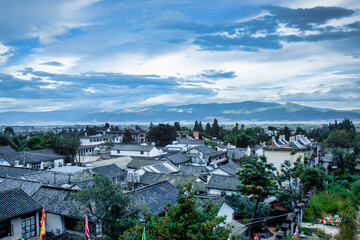 Dali, China 2013-09-02 Dramatic clouds over the rooftops of Dali, Yunnan province, China