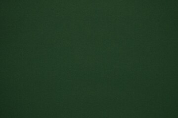 Dark green monotone background. Dark green paper.