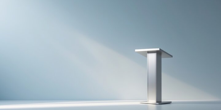 Silver podium on white surface with light blue wall backdrop.