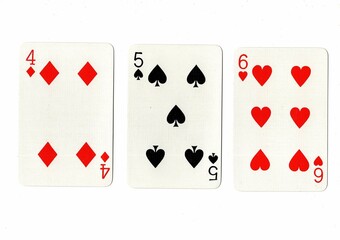 A hand of playing cards showing a run of three on a white background.