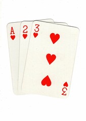 A hand of playing cards showing a run of three on a white background.