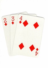 A hand of playing cards showing a run of three on a white background.