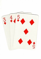 A hand of playing cards showing a run of three on a white background.