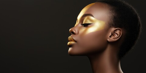 Fototapeta premium A woman with gold face paint and a gold nose. She has gold eyeshadow and gold lipstick