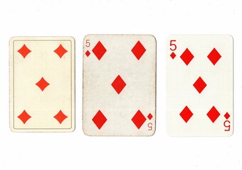 Obraz premium Vintage playing cards in three different designs showing the same value.