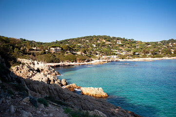 Coastal landscape near the town of Cavalaire in the south of France. Coastal path with views of the Mediterranean sea, hills covered by a forest of maritime pines.