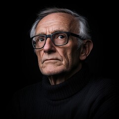 Obraz premium An elderly man in glasses with a thoughtful look, deep wrinkles give the portrait character. 
