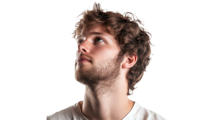 Young man gazes upwards in thought