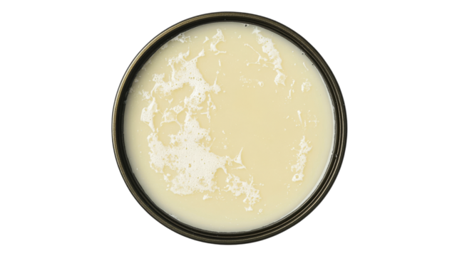 Creamy substance in shallow bowl on white surface