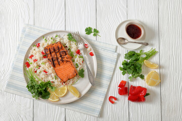 grilled red salmon fillet with rice, top view