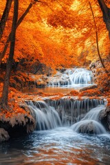 Fototapeta premium River flowing through autumn foliage with waterfall in background.