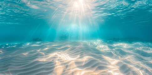 Underwater ocean landscape with sunlight falling through the surface. Empty blue sea summer background. 