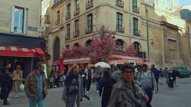 Parisian Street with Bustling Cafe and Pedestrians