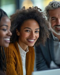 Diverse group with a woman smiling at camera during meeting.