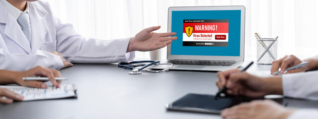 Virus warning alert on computer screen detected brisk cyber threat , hacker, computer virus and malware