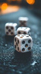 Four white dice with black dots on a textured dark surface. Bokeh lights in the background.